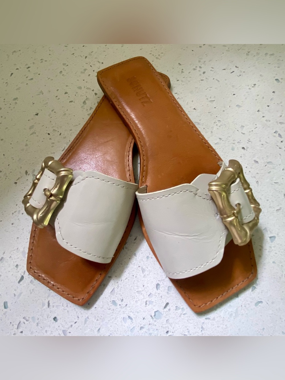 SCHUTZ ENOLA Cream Leather Slide Mules with Gold Bamboo Buckle